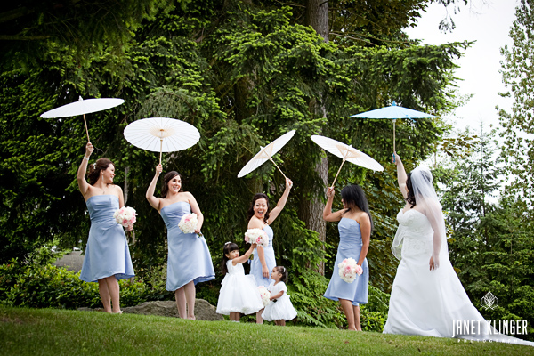 Seattle Bridal party in blue dresses carry White Parasols from The Knot