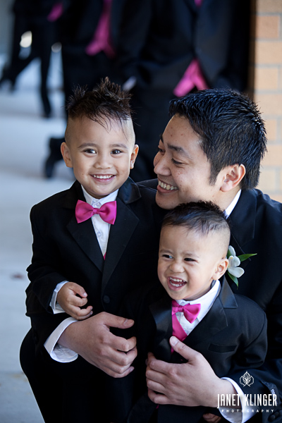 Two Filipino ring bearers in Seattle wearing pink bow ties