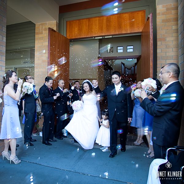 The playful bubble-blowing recessional exit of the Bride and Groom from St Vincent De Paul in Federal Way WA